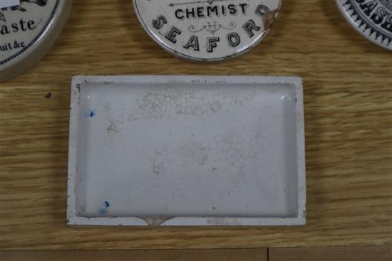 A collection of eighteen mainly black printed tooth,anchovy and other paste pot lids, including Yardley